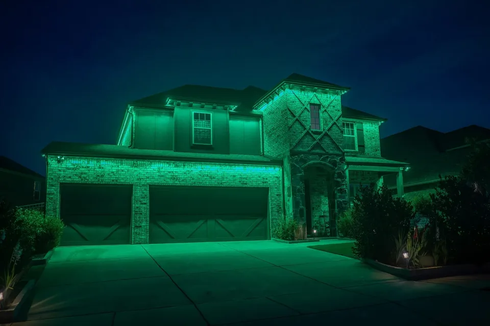 A full green wash across a two story elevation, roofline and walls together.