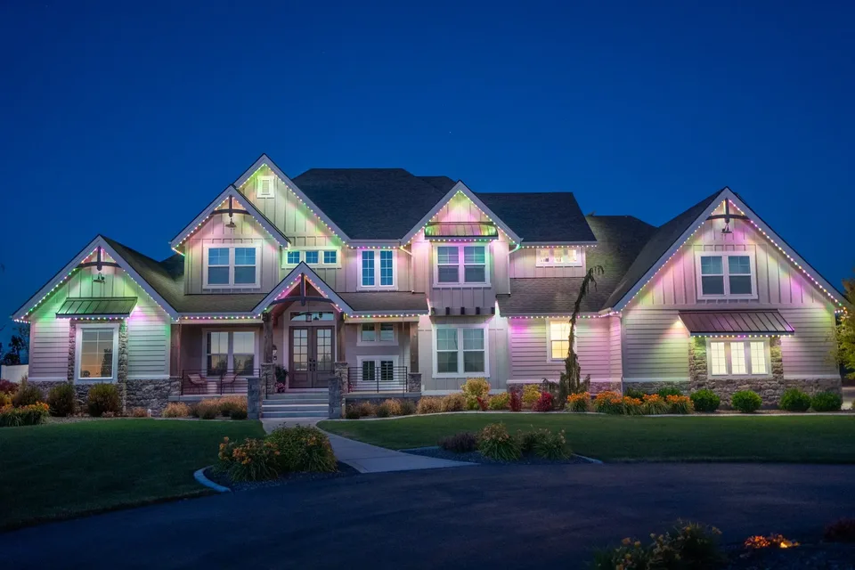 A different pastel on each gable of a wide craftsman, green at one end and pink and lavender across the rest.