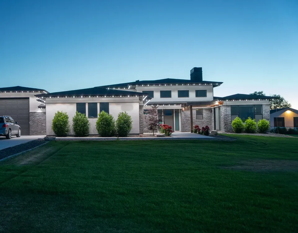 The same elevation, in cool white against a bright evening sky.